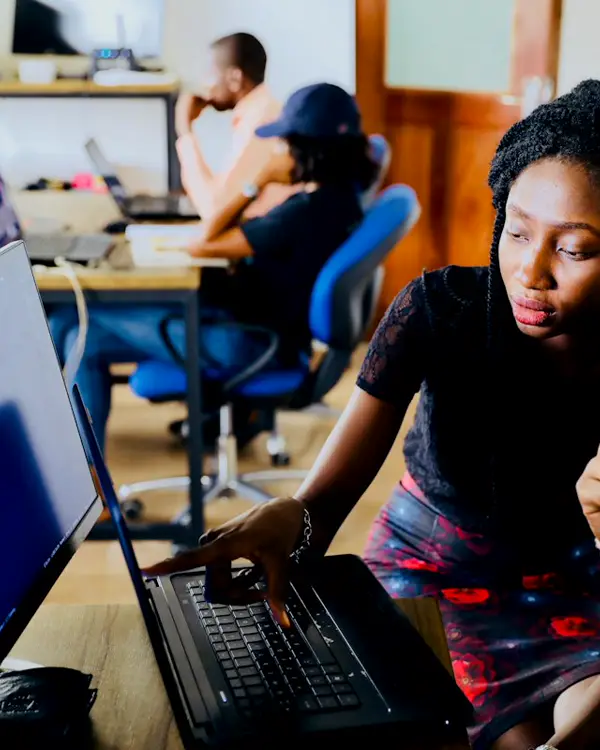 Engineers reviewing a product on screen
